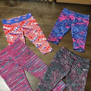 4 pairs of Nike capris one leggings
